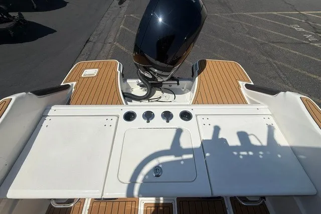 Slide: The Image of 2027 Bayliner Trophy T20CC boat with sleek deck and powerful outboard motor. - 19