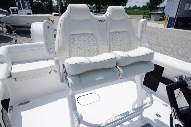 Slide: The Image of 2027 Tidewater 256 LXF boat with luxurious white seating and modern design. - 50