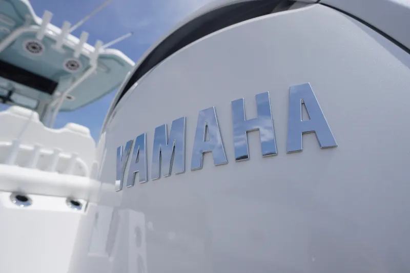 Slide: The Image of Close-up of Yamaha engine on 2027 Tidewater 256 LXF boat. - 76