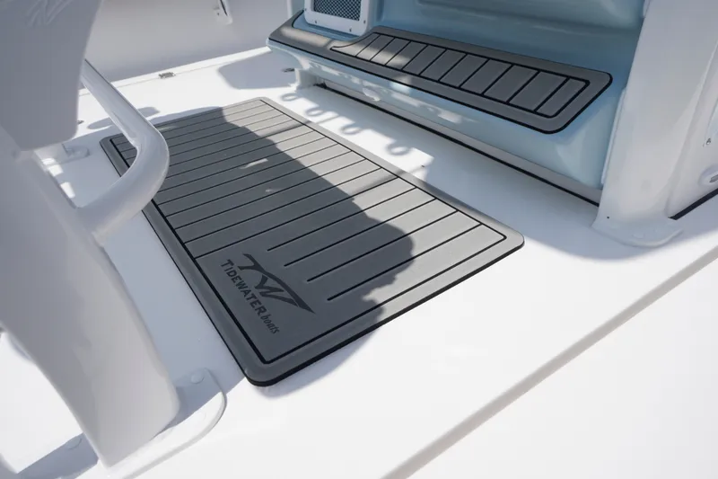 Slide: The Image of Deck of 2027 Tidewater 256 LXF boat with branded non-slip mat. - 47