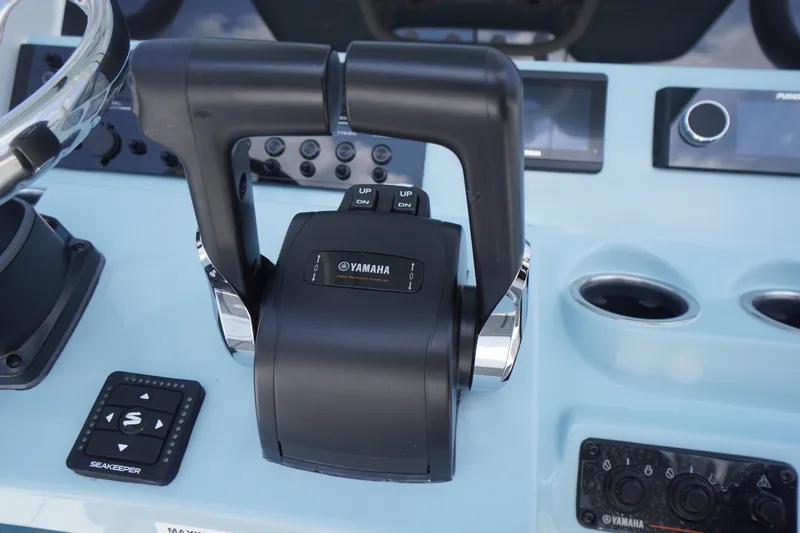 Slide: The Image of Control panel of 2027 Tidewater 256 LXF boat featuring Yamaha throttle system. - 34