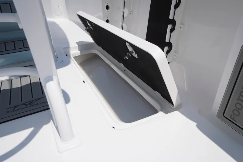 Slide: The Image of Open storage compartment on 2027 Tidewater 256 LXF boat deck. - 53
