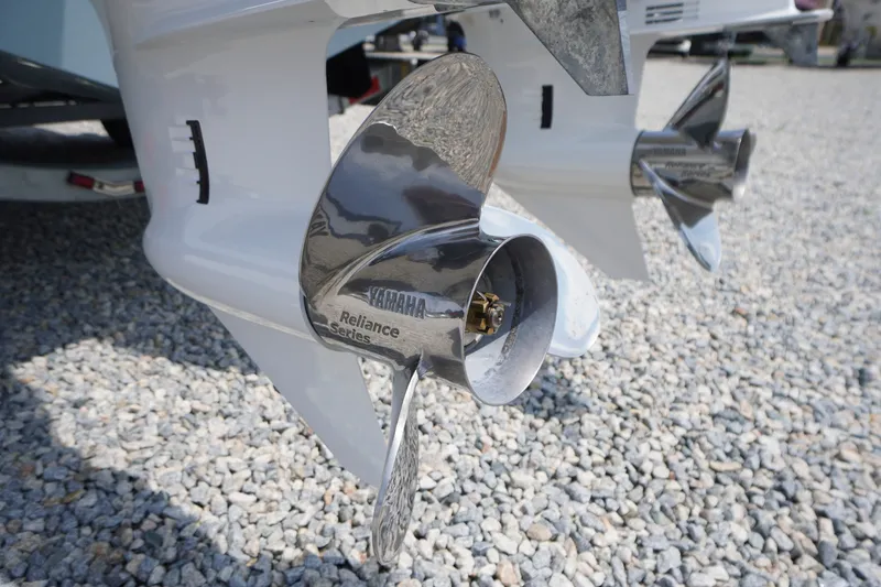 Slide: The Image of Yamaha Reliance Series propeller on 2027 Tidewater 256 LXF boat, gravel background. - 77