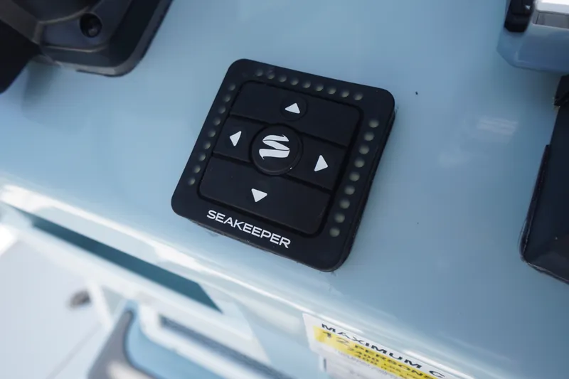 Slide: The Image of Seakeeper control panel on 2027 Tidewater 256 LXF boat dashboard. - 38