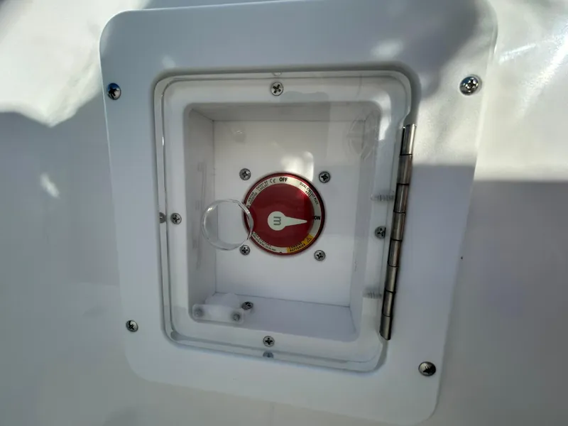 Slide: The Image of 2025 Tidewater 256 LXF boat battery switch compartment. - 44