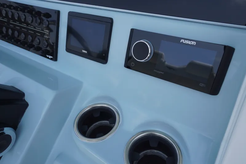 Slide: The Image of Control panel of 2027 Tidewater 256 LXF boat with Yamaha and Fusion displays. - 33