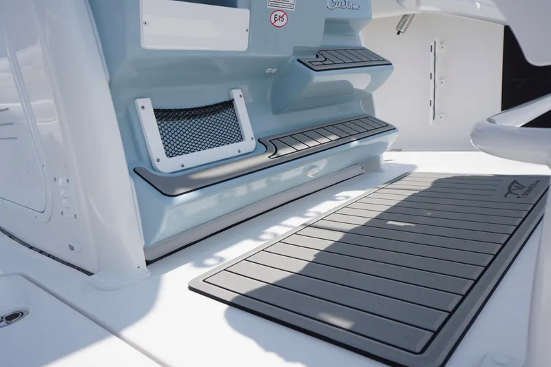 Slide: The Image of 2027 Tidewater 256 LXF boat interior with non-slip flooring and storage compartments. - 46