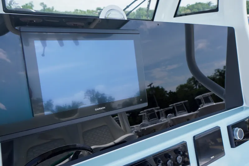 Slide: The Image of Garmin display on 2027 Tidewater 256 LXF boat dashboard, showcasing modern navigation technology. - 31