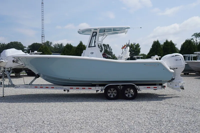 The Image of 2027 Tidewater 256 LXF boat on trailer in outdoor showroom. - 0