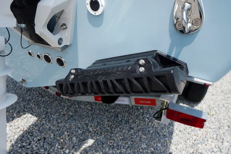 Slide: The Image of Rear view of 2027 Tidewater 256 LXF boat with Seakeeper stabilizer. - 78