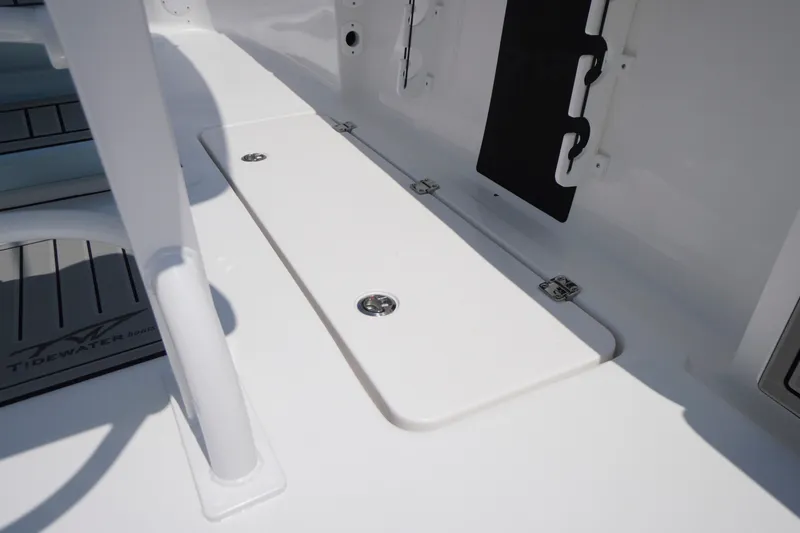 Slide: The Image of 2027 Tidewater 256 LXF boat deck with storage compartment and sleek design. - 52
