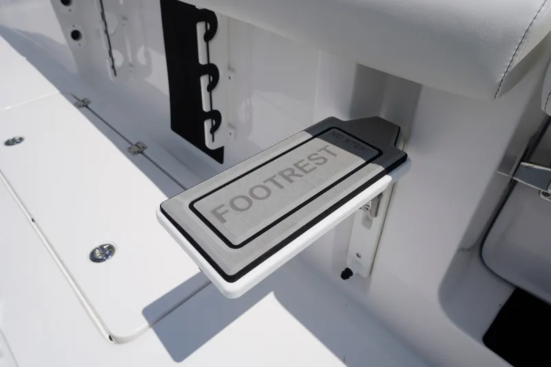 Slide: The Image of 2027 Tidewater 256 LXF boat footrest detail, showcasing sleek design and functionality. - 65