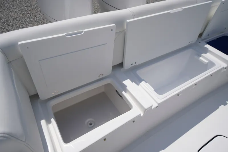 Slide: The Image of 2027 Tidewater 256 LXF boat storage compartments open on deck. - 59