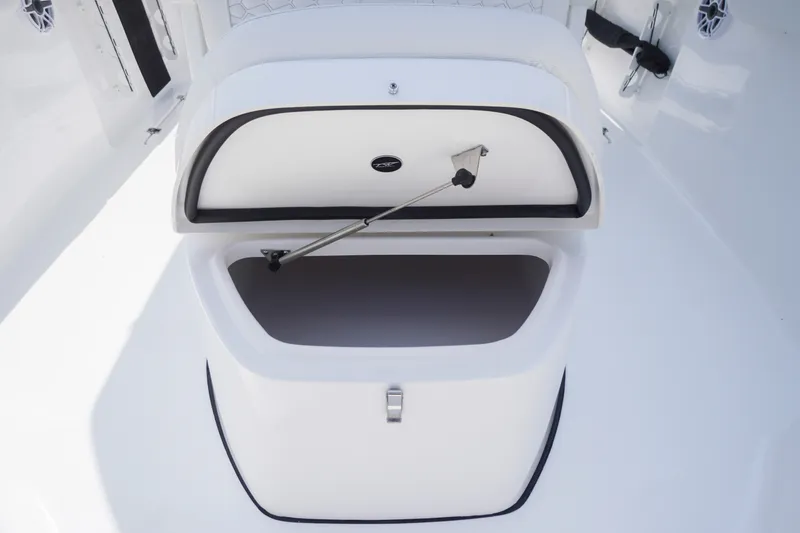 Slide: The Image of Open storage compartment on a 2027 Tidewater 256 LXF boat deck. - 18
