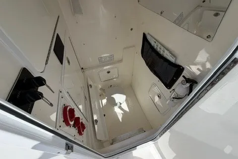 Slide: The Image of 2007 Regulator 29 Forward Seating boat interior, showcasing storage and control panels. - 53