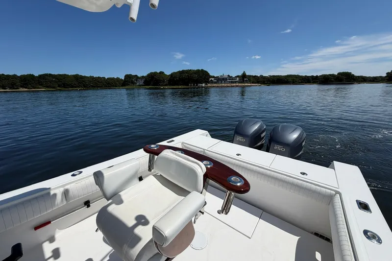 Slide: The Image of 2007 Regulator 29 Forward Seating boat on calm water with dual Yamaha engines. - 47