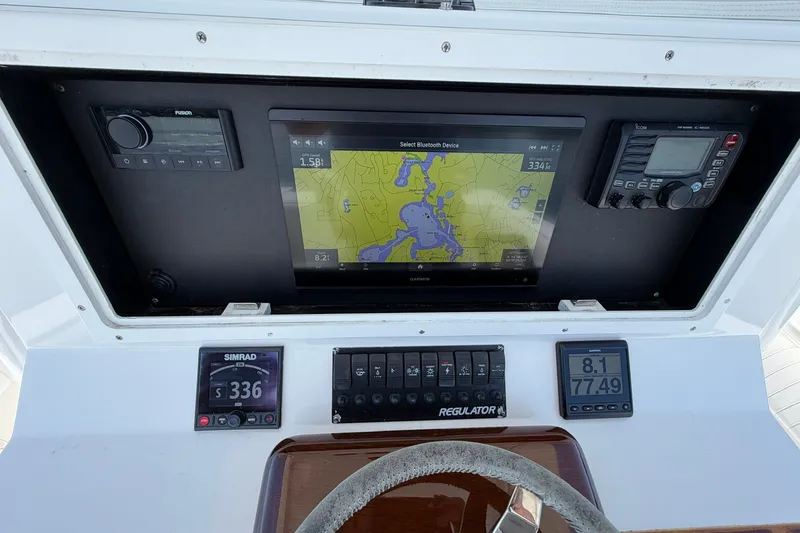 Slide: The Image of 2007 Regulator 29 Forward Seating dashboard with navigation and control systems. - 56