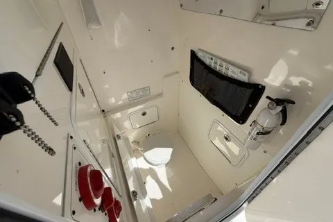 Slide: The Image of 2007 Regulator 29 Forward Seating interior with storage, fire extinguisher, and control panel. - 52