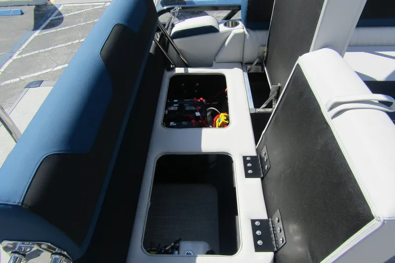 Slide: The Image of 2026 Tahoe Pontoon LTZ Cruise Rear Bench 23 with open storage compartments. - 27