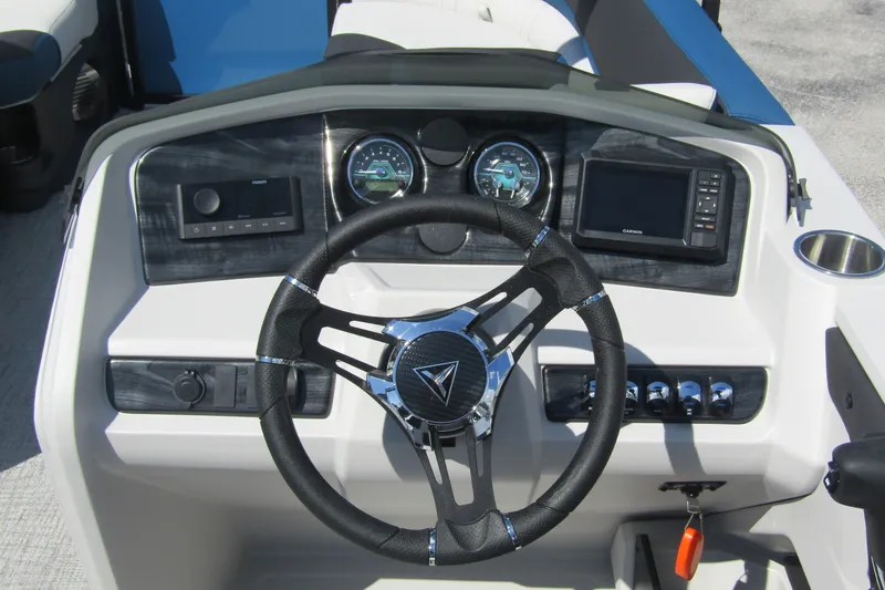Slide: The Image of Steering console of 2026 Tahoe Pontoon LTZ Cruise Rear Bench 23 with gauges and controls. - 17
