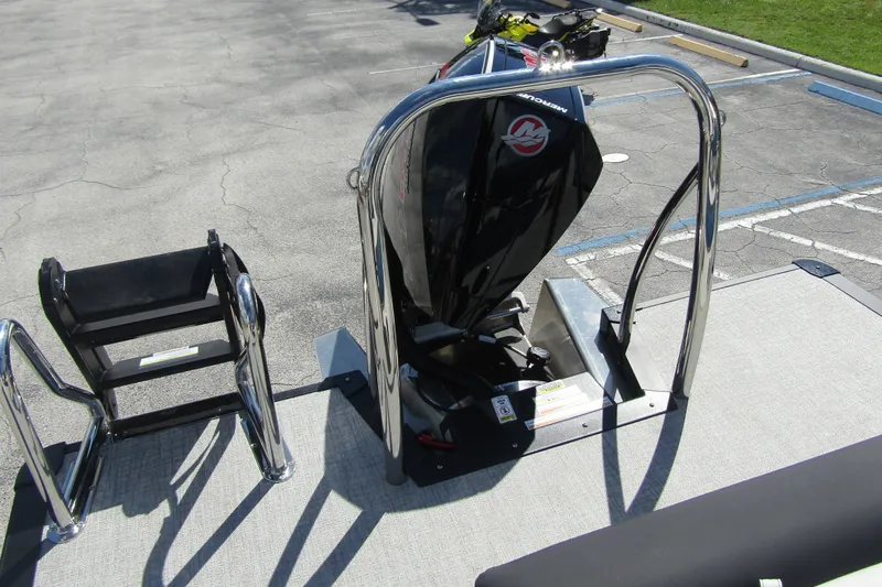 Slide: The Image of 2026 Tahoe Pontoon LTZ Cruise Rear Bench 23 with Mercury outboard motor and ladder. - 32