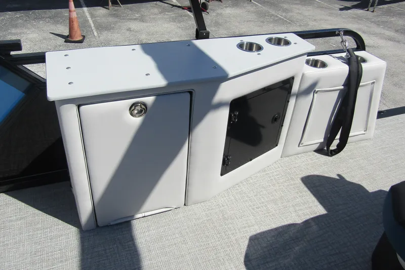 Slide: The Image of 2026 Tahoe Pontoon LTZ Cruise Rear Bench 23, featuring storage compartments and cup holders. - 28
