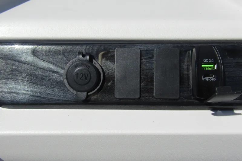 Slide: The Image of 12V marine socket and USB-C port on 2026 Tahoe Pontoon LTZ Cruise Rear Bench 23. - 21
