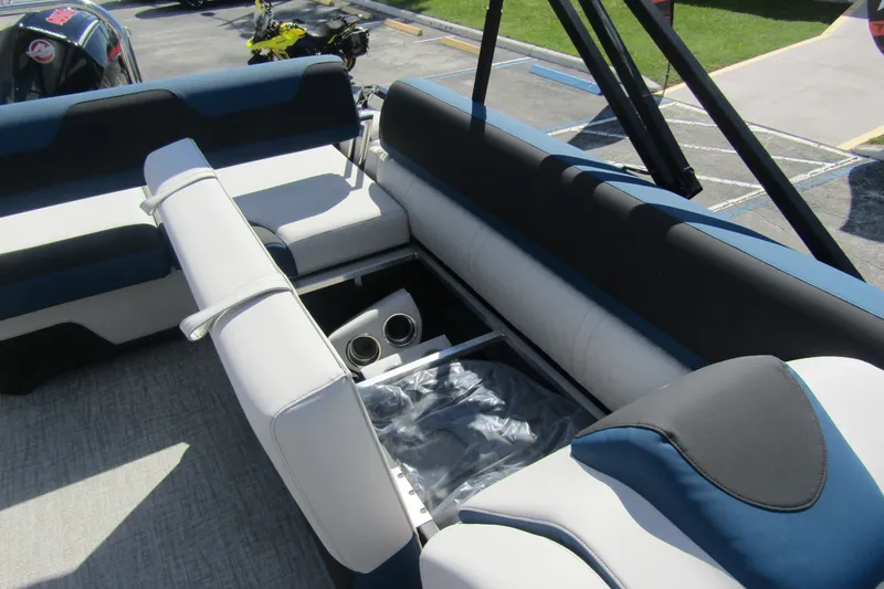 Slide: The Image of 2026 Tahoe Pontoon LTZ Cruise Rear Bench 23 interior with seating and storage. - 25