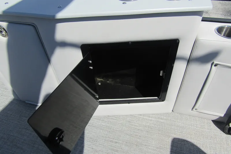 Slide: The Image of Open storage compartment on 2026 Tahoe Pontoon LTZ Cruise Rear Bench 23 boat interior. - 30