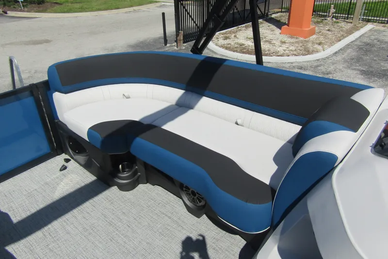 Slide: The Image of 2026 Tahoe Pontoon LTZ Cruise Rear Bench 23 with blue and white seating. - 13