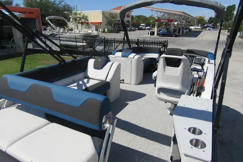 Slide: The Image of 2026 Tahoe Pontoon LTZ Cruise Rear Bench 23 with modern seating and helm. - 33
