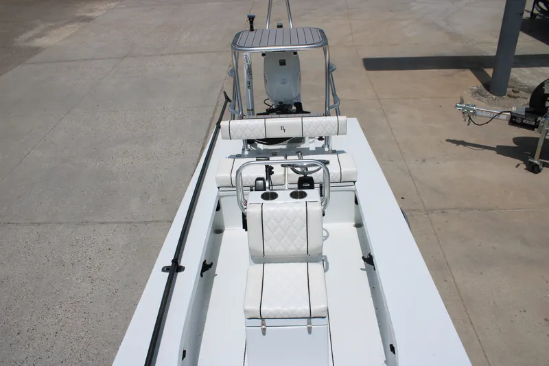 Slide: The Image of 2022 Beavertail Skiffs Mosquito 18' boat interior with seating and steering console. - 15
