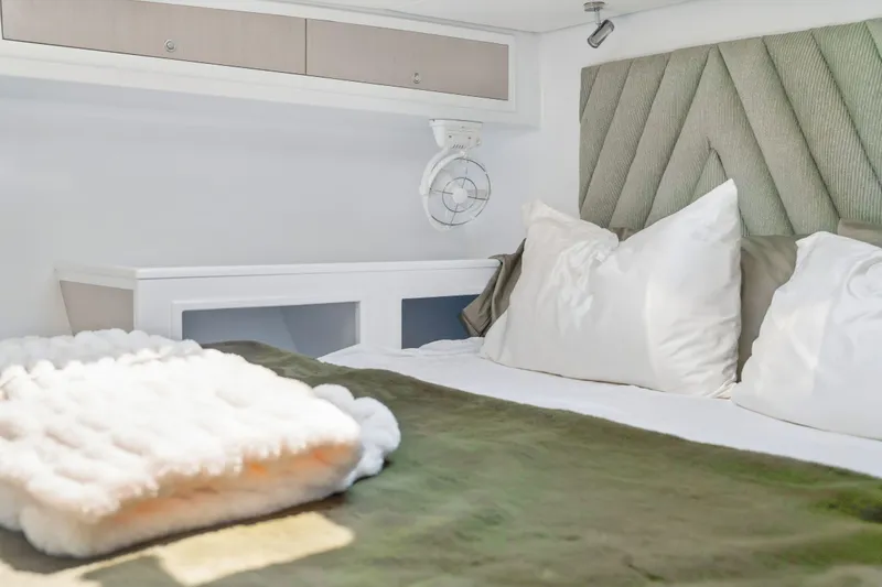 Slide: The Image of Luxurious bedroom interior in Balance 526 yacht, featuring plush bedding and modern design, 2025 model. - 82