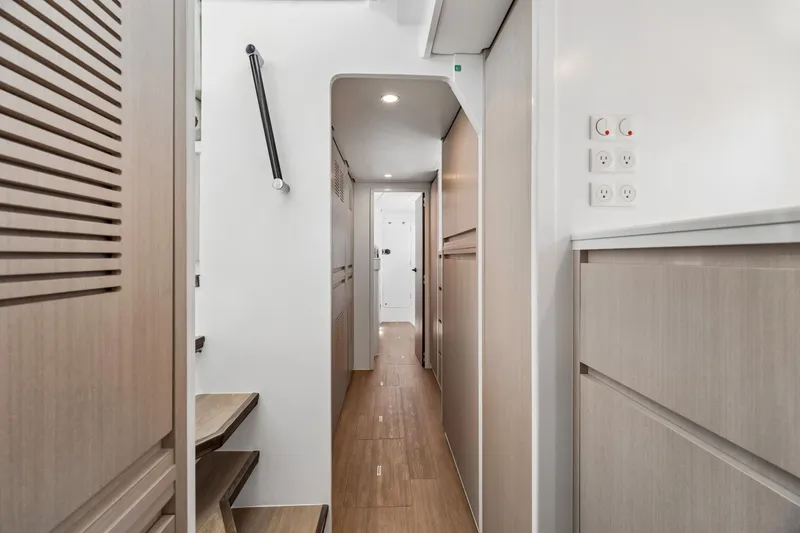 Slide: The Image of Modern interior hallway of Balance 526 yacht, featuring sleek wood finishes and minimalist design, 2025 model. - 68
