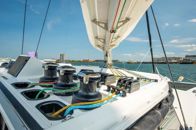 Slide: The Image of Modern Balance 526 sailboat deck with winches and ropes, 2025 model, sailing in sunny harbor. - 119
