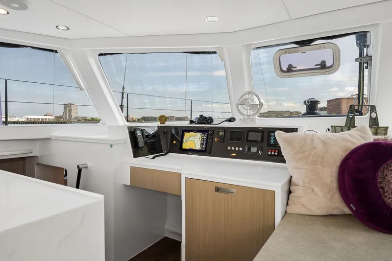 Slide: The Image of Modern yacht interior with navigation controls, plush seating, and panoramic windows. Balance 526, 2025 model. - 48