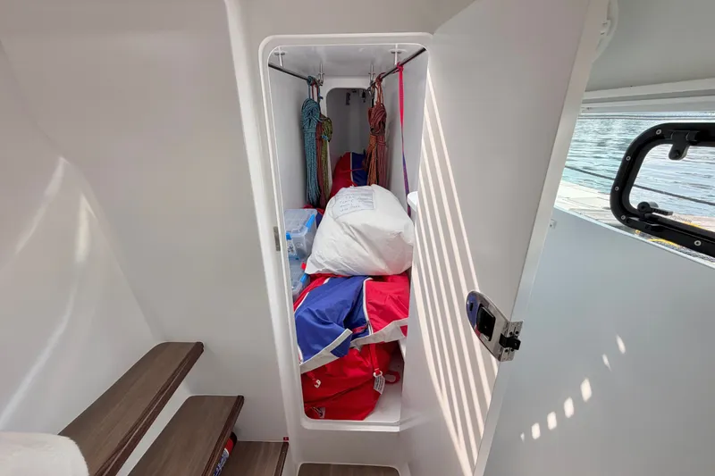 Slide: The Image of Storage compartment on Balance 526 yacht, featuring ropes and sailing gear, 2025 model. - 75