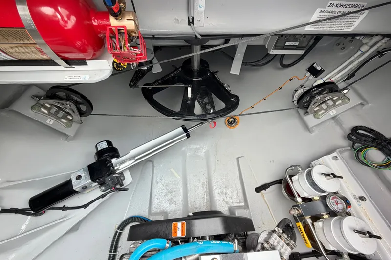 Slide: The Image of Engine room of Balance 526 yacht, featuring fire extinguisher and mechanical components, 2025 model. - 91