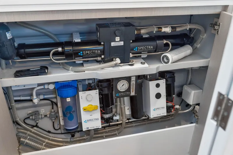 Slide: The Image of High-tech watermaker system inside a Balance 526 model, featuring Spectra components, 2025. - 104