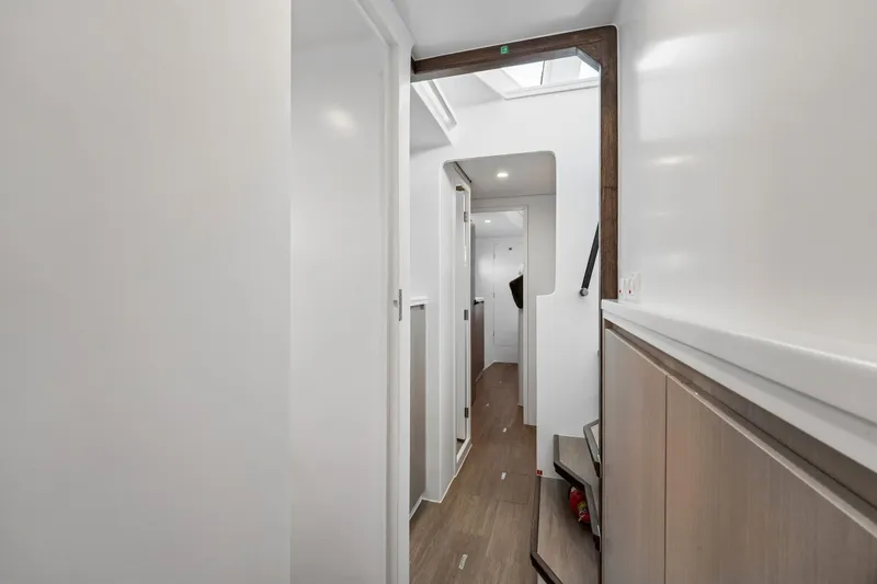 Slide: The Image of Modern interior hallway of Balance 526 yacht, 2025 model, featuring sleek design and wood accents. - 77