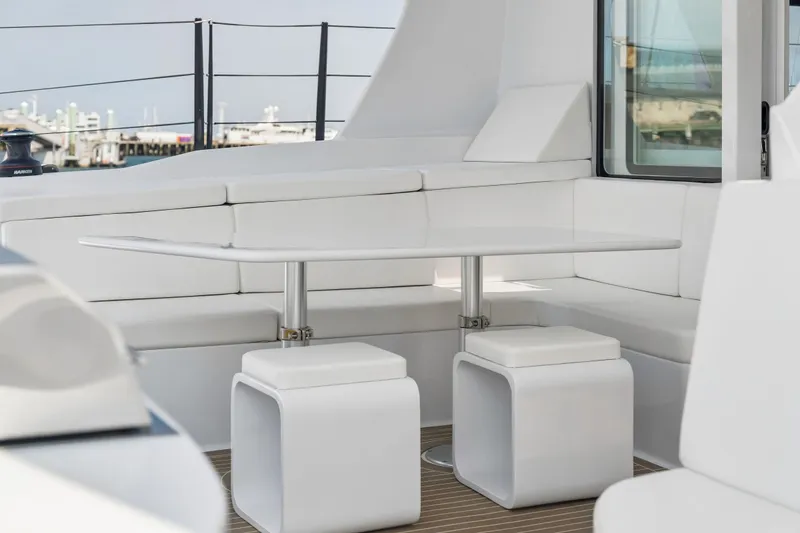 Slide: The Image of Modern seating area on Balance 526 yacht, featuring sleek white furniture and elegant design, 2025 model. - 60