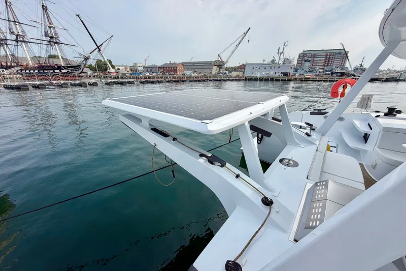 Slide: The Image of Modern Balance 526 yacht with solar panels docked at a marina, 2025 model. - 133
