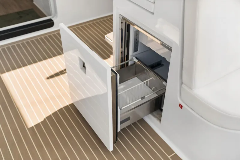 Slide: The Image of Open drawer refrigerator on Balance 526 yacht, 2025 model, with sleek white design. - 62