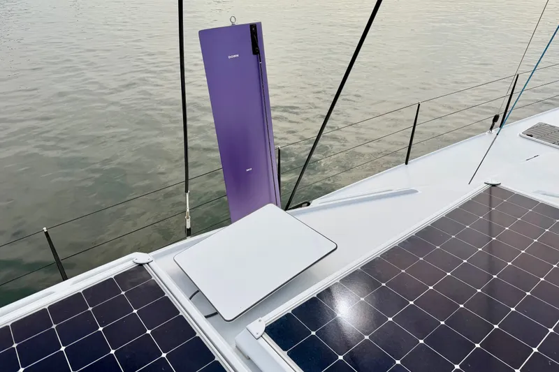 Slide: The Image of Sailboat deck with solar panels and a purple wind turbine, Balance 526 model, 2025. - 16
