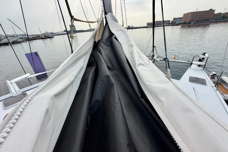 Slide: The Image of Sailboat deck view with sails furled, Balance 526 model, docked at a marina. - 13