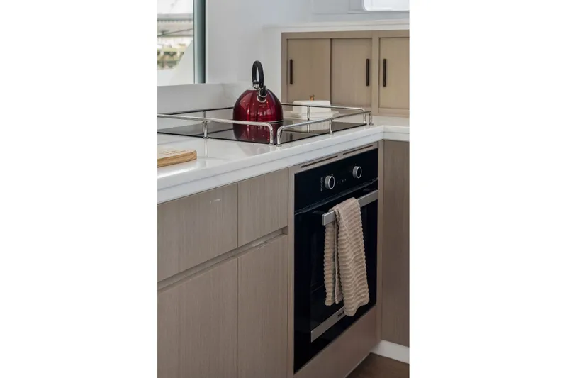 Slide: The Image of Modern kitchen with Balance 526 oven, red kettle, and beige cabinets, 2025 model. - 42