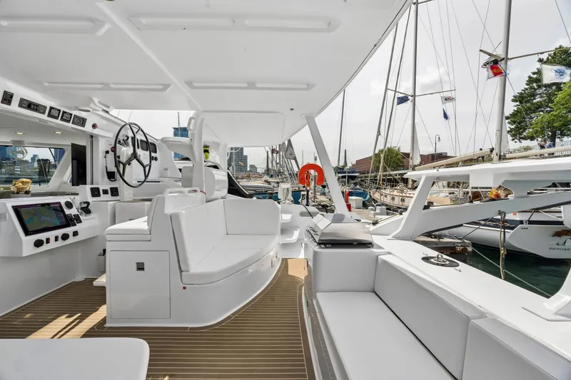 Slide: The Image of Modern Balance 526 yacht interior, featuring sleek design and advanced navigation systems, docked at marina. - 27