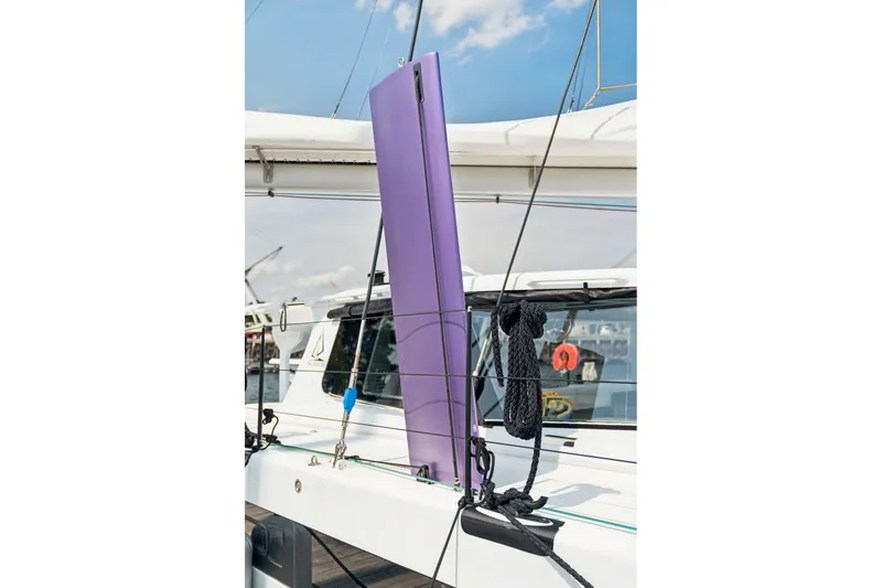Slide: The Image of Sailboat deck with purple daggerboard, Balance 526 model, 2025. - 116