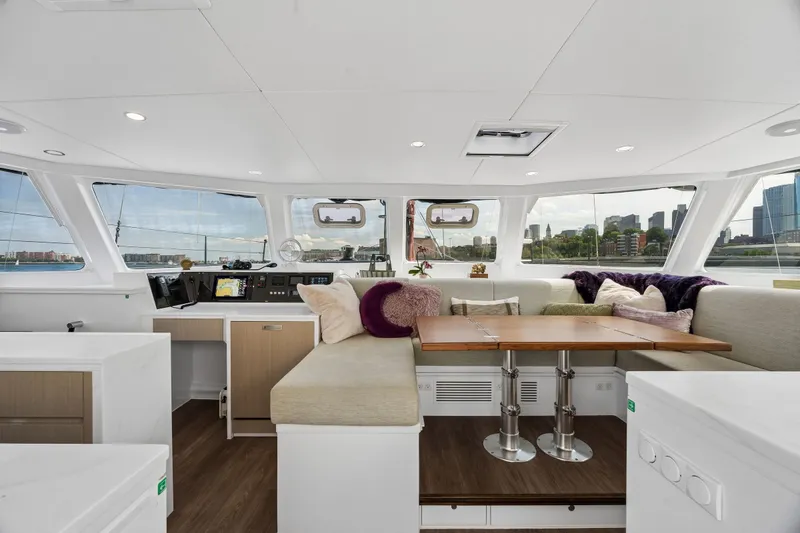 Slide: The Image of Luxurious interior of 2025 Balance 526 yacht with panoramic windows and plush seating. - 39