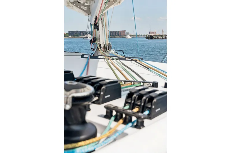 Slide: The Image of Sailing yacht deck with colorful ropes, Balance 526 model, 2025, on a sunny day. - 123